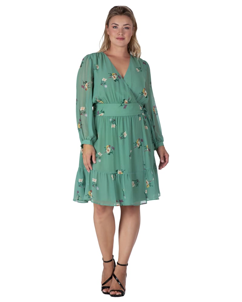 Front of a model wearing a size L Women's Sage Green Floral Print Wrap Mini Dress in SAGEGRNFLRL by Standards & Practices. | dia_product_style_image_id:275799